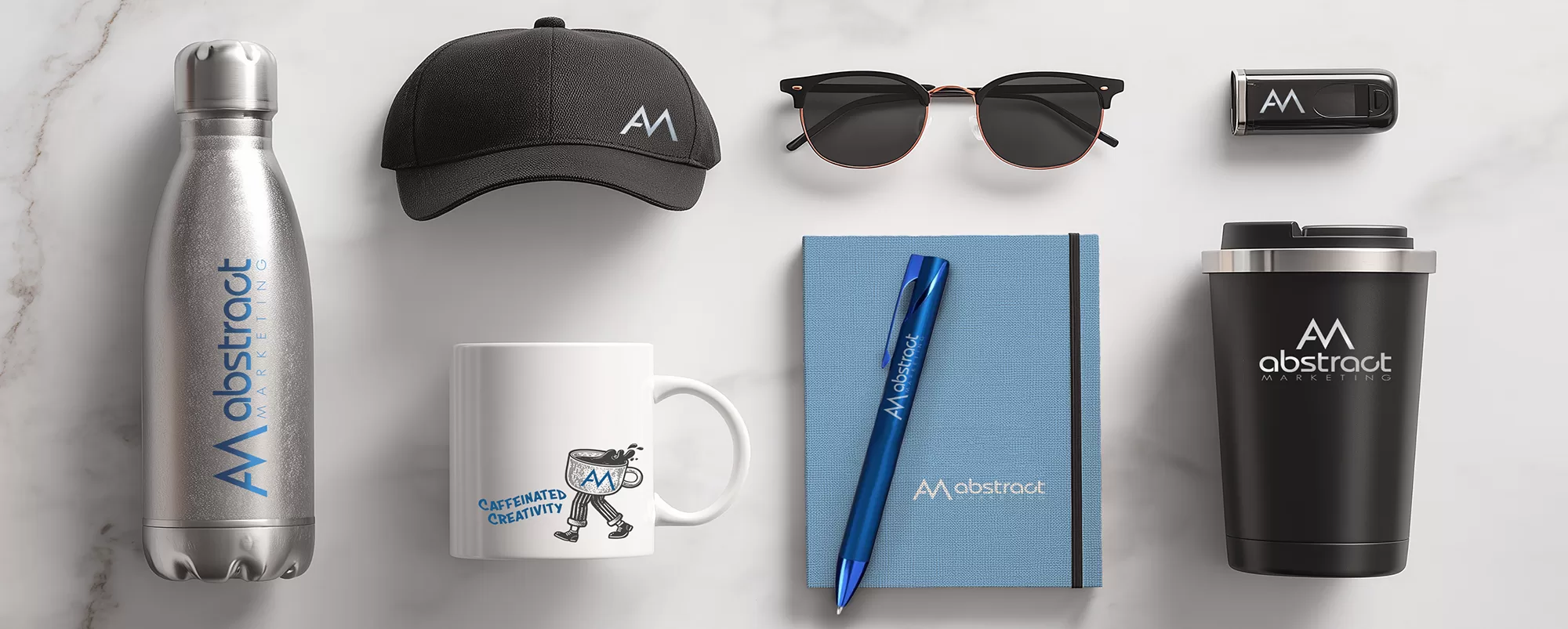 Assorted blue promotional products on a white surface